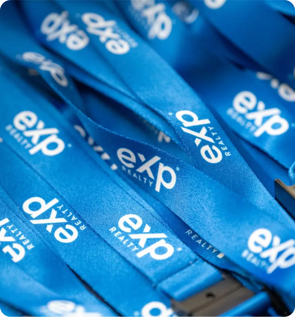 Close-up of blue eXp Realty lanyards.